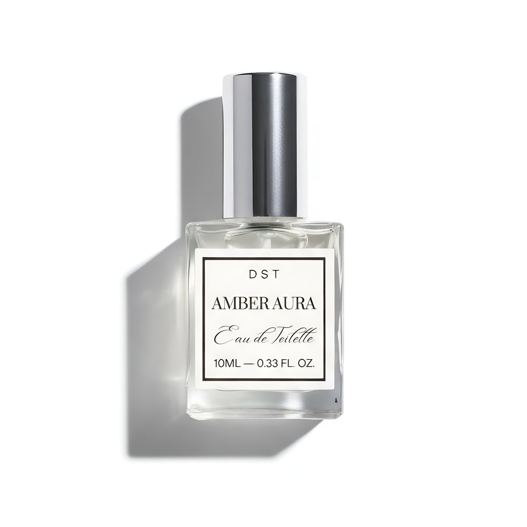 Amber aura Eau de Toilette bottle with silver cap on a white background