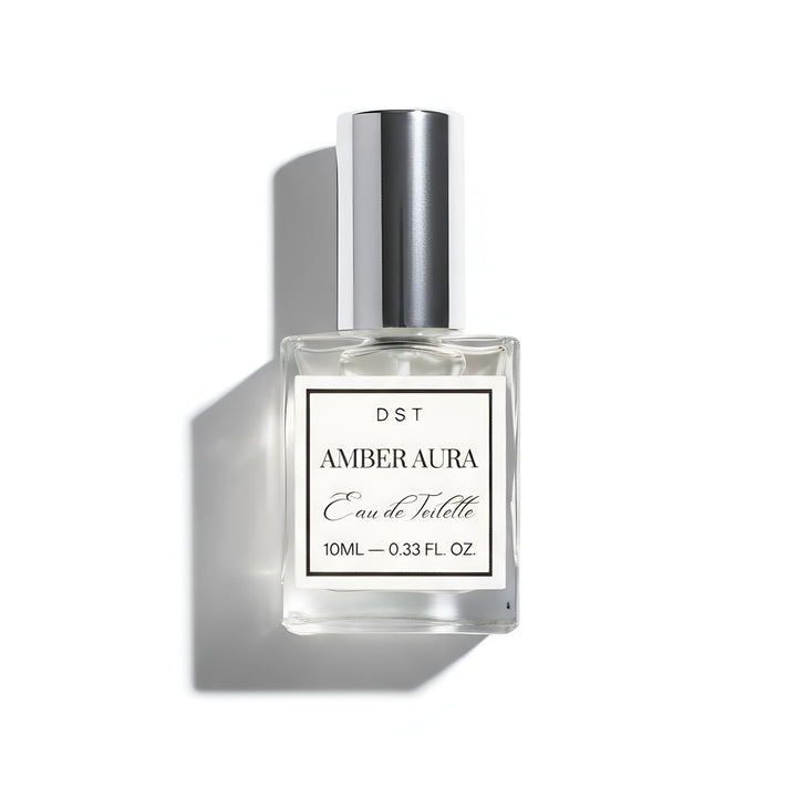 Amber aura Eau de Toilette bottle with silver cap on a white background