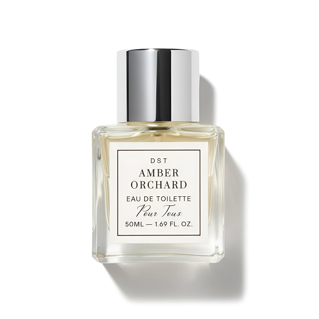 Perfume bottle labeled 'Amber Orchard' by DST on a white background