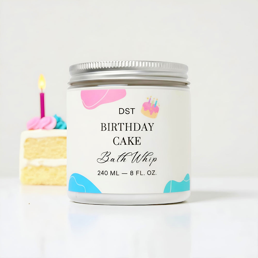 Bath whip container labeled 'DST Birthday Cake' with a cake illustration on a white background