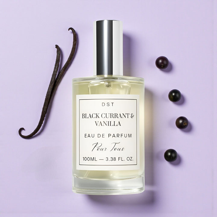 DST Fragrances Perfume bottle labeled 'Black Currant & Vanilla' with black currants and vanilla beans on a purple background