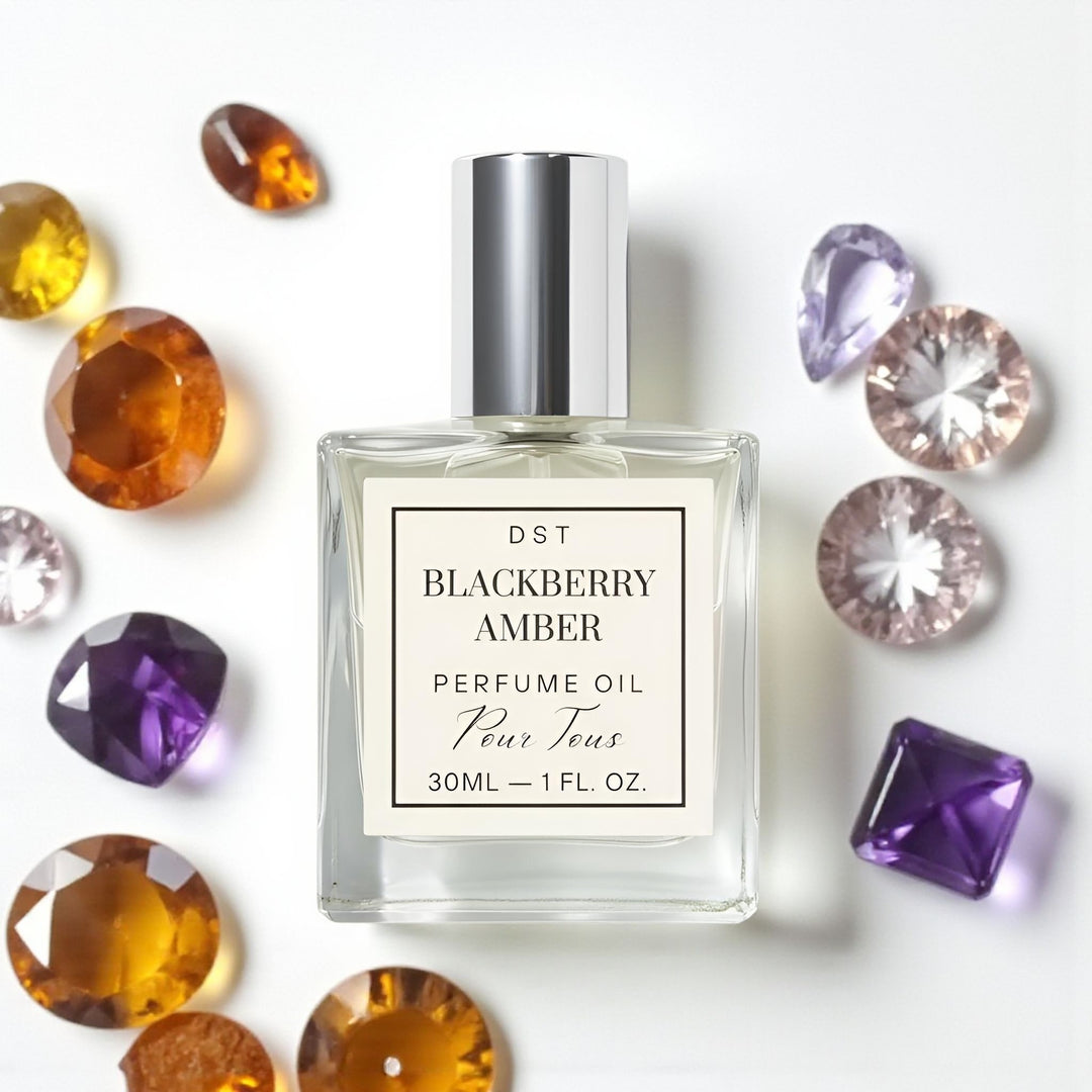 Blackberry Amber Perfume Oil against an ivory background with am