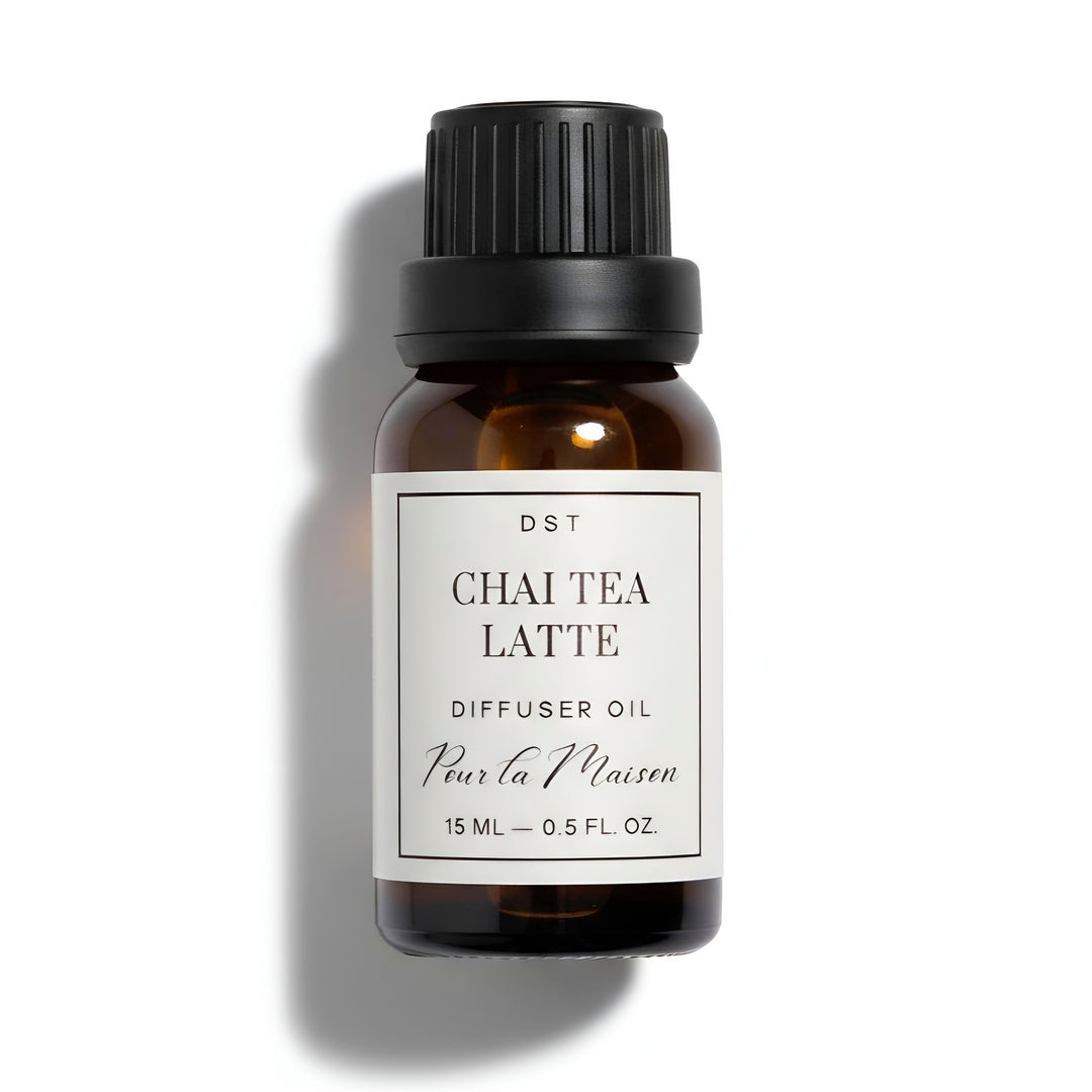 Bottle of Chai Tea Latte diffuser oil with a black cap on a white background