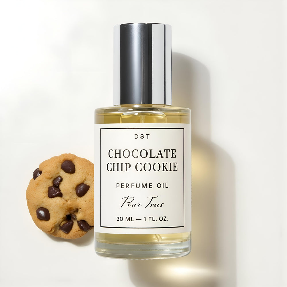 DST Fragrances Perfume oil bottle labeled 'Chocolate Chip Cookie' with cookies on a beige background