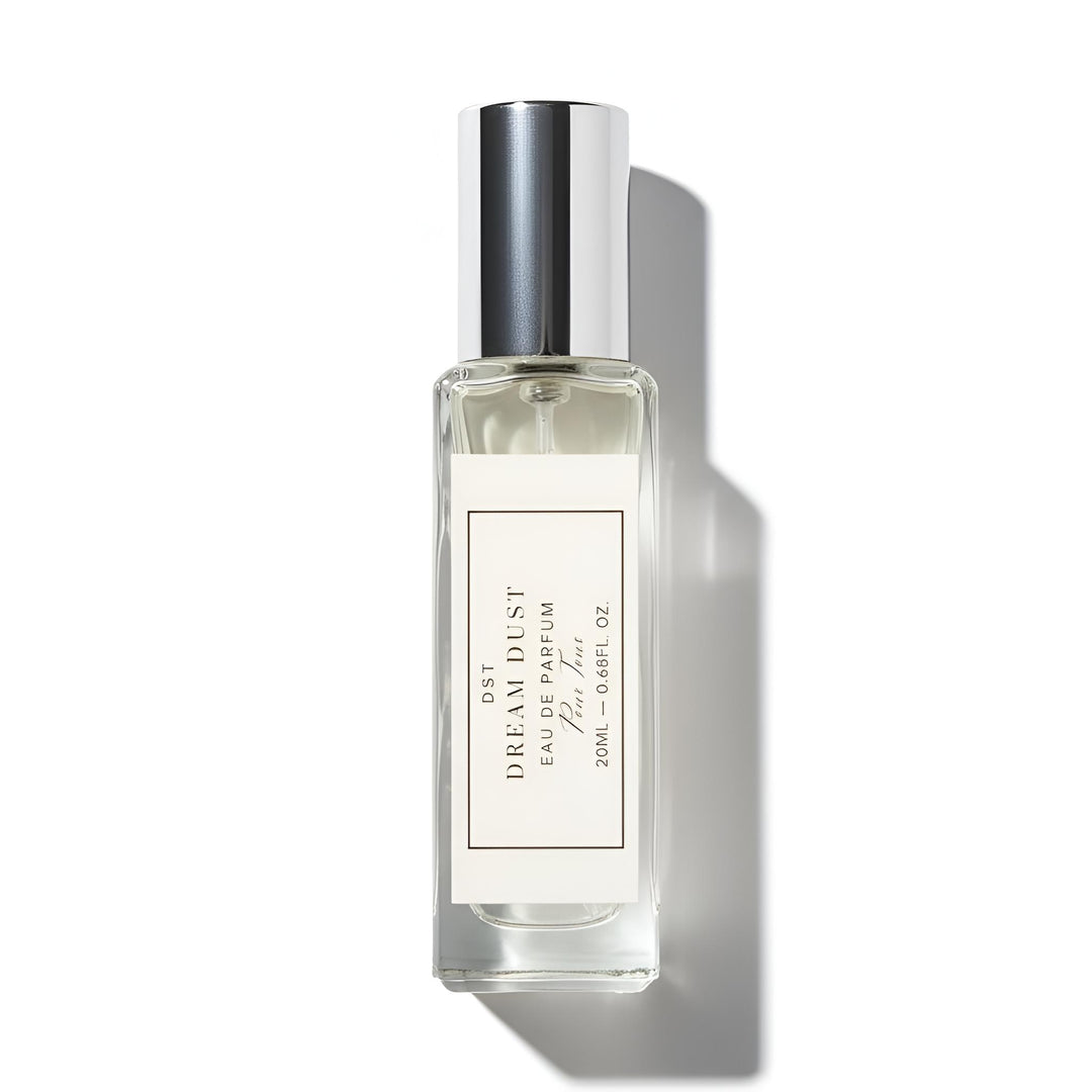 Perfume bottle labeled 'Dream Dust' on a white background