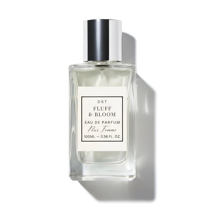Perfume bottle labeled 'Fluff & Bloom' on a white background