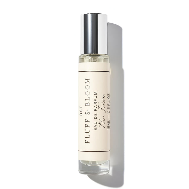 Perfume bottle labeled 'Fluff & Bloom' on a white background