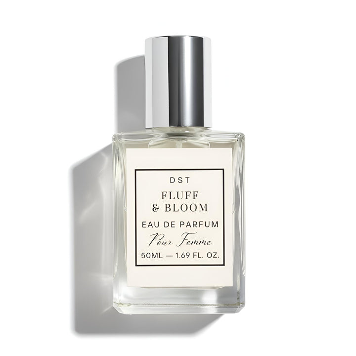 Perfume bottle labeled 'Fluff & Bloom' on a white background
