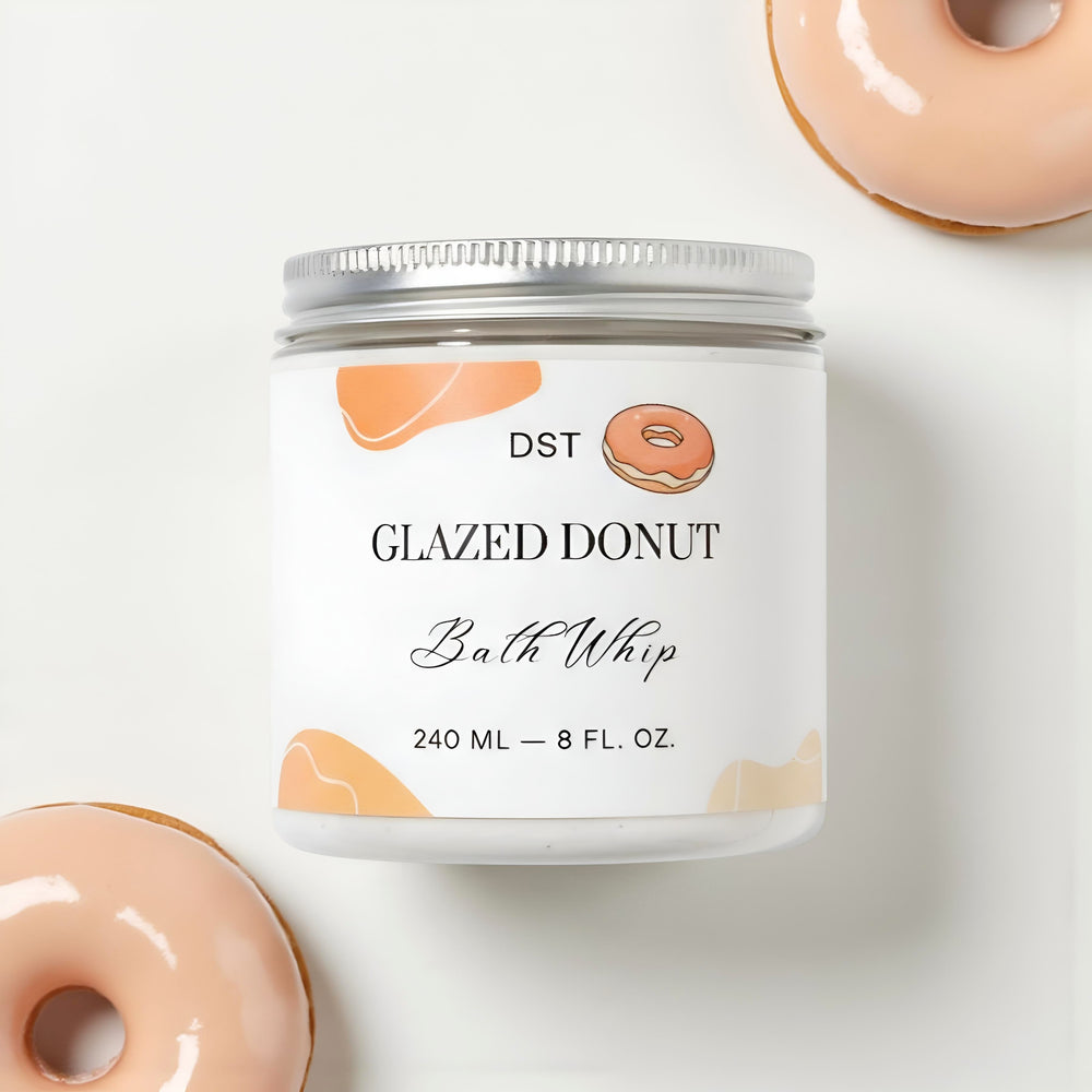 Bath whip container labeled 'Glazed Donut' with donuts on a white background