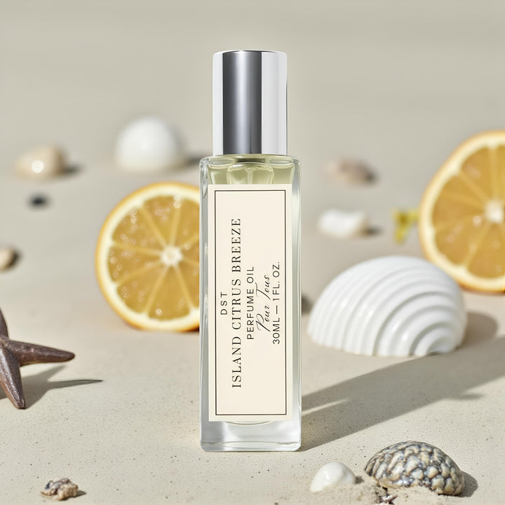 Perfume oil bottle labeled 'Island Citrus Breeze' on a neutral background and sand.