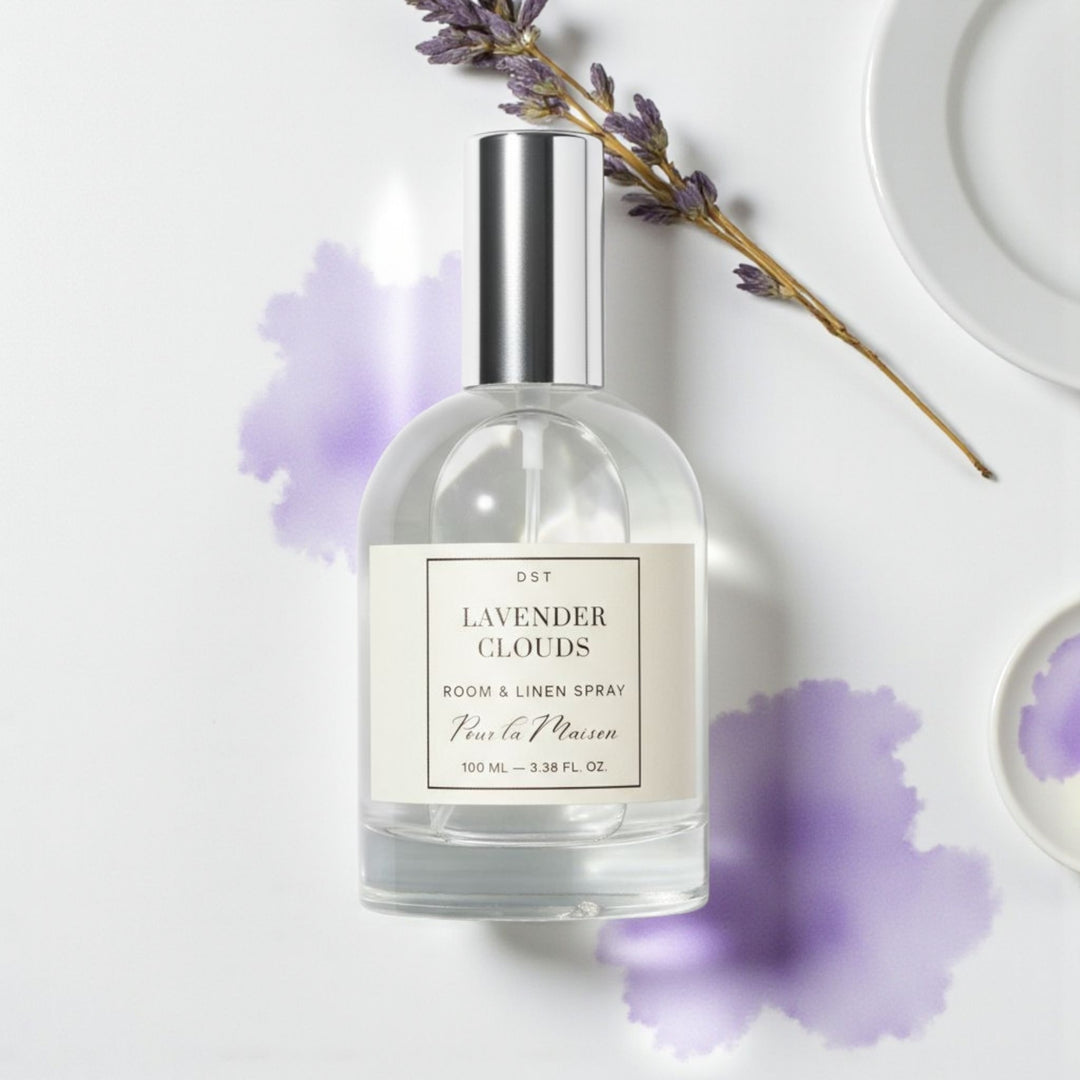 Lavender cloud room spray bottle with lavender flowers on a white background