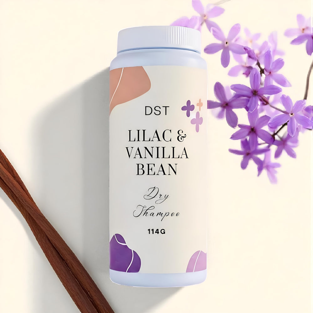 Shampoo bottle labeled 'Lilac & Vanilla Bean' with flowers and vanilla beans on a light background