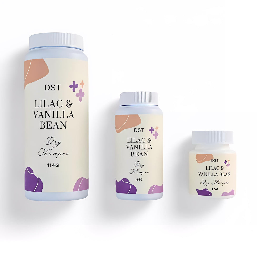 Three bottles of DST Lilac & Vanilla Bean Dry Shampoo on a white background