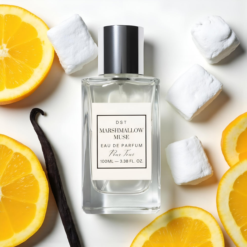 Perfume bottle labeled 'Marshmallow Muse' with vanilla bean and orange slices on a light background