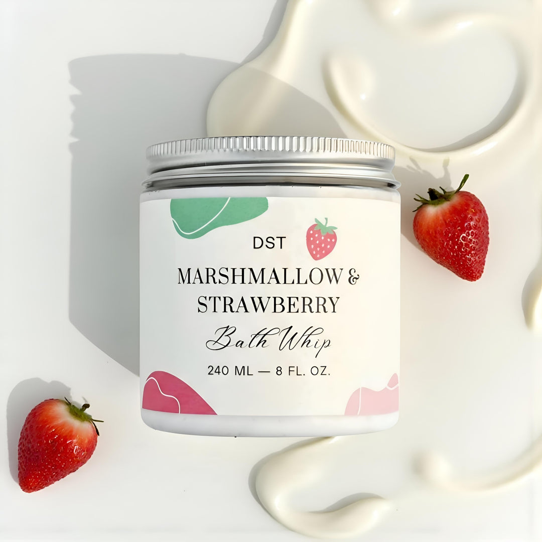 Jar of Marshmallow & Strawberry bath whip with strawberry illustrations on a beige background