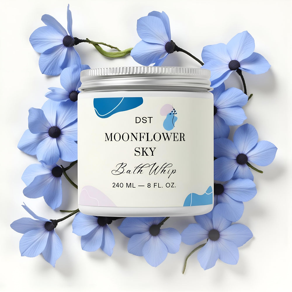 Bath whip container labeled 'Moonflower Sky' with abstract designs on a light blue background