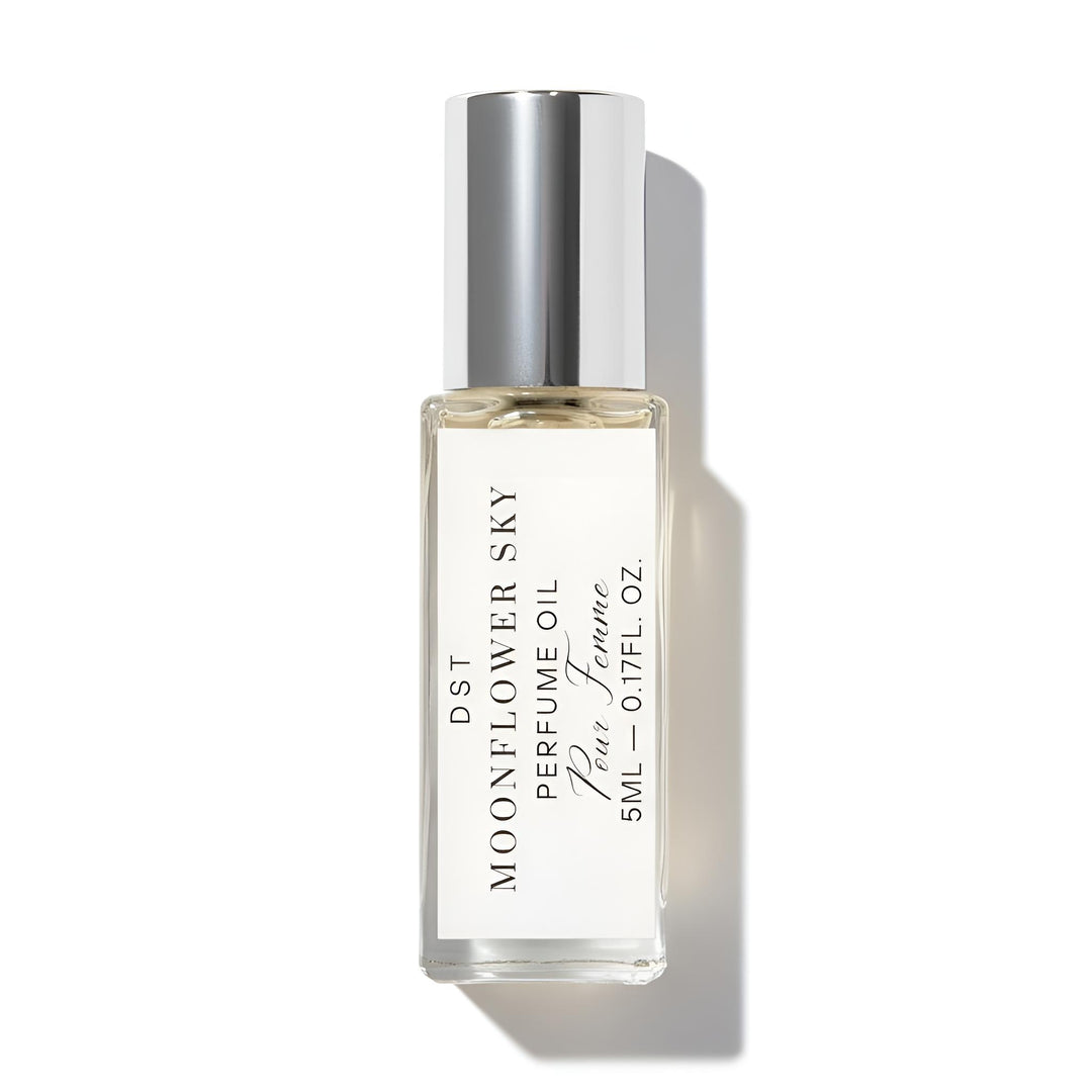 Perfume oil bottle labeled 'Moonflower Sky' on a white background