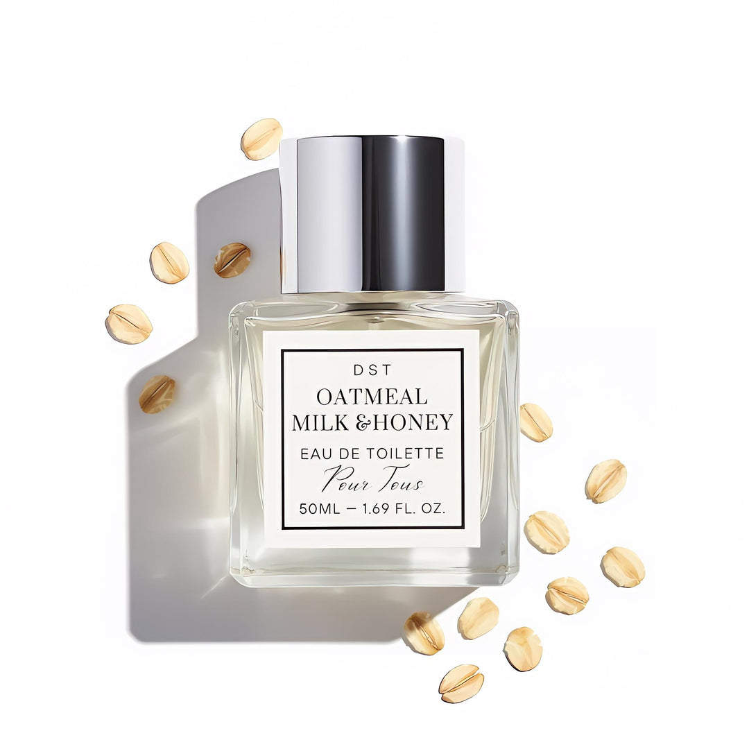 Perfume bottle labeled 'Oatmeal Milk & Honey' on a yellow background with honeycomb and oats.