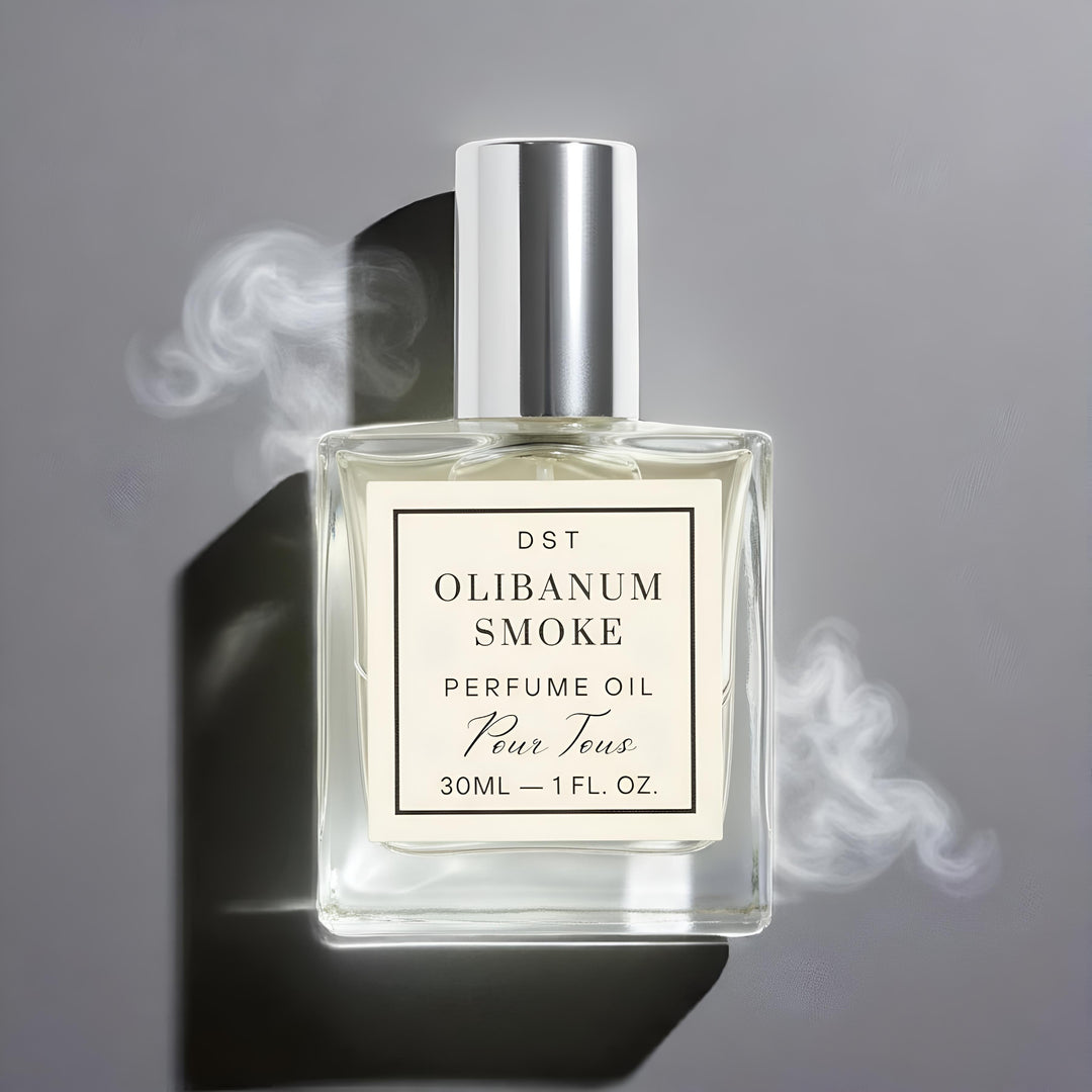 Perfume oil bottle labeled 'Olibanum Smoke' with smoke effect on a gray background