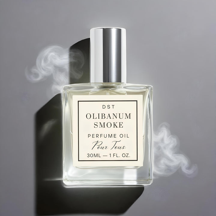 Perfume oil bottle labeled 'Olibanum Smoke' with smoke effect on a gray background