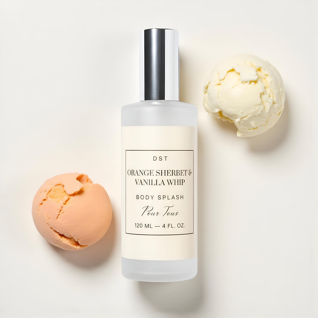 Fragrance bottle labeled 'Orange Sherbet Vanilla Whip' with an ice cream cone container and packaging on a wooden surface.