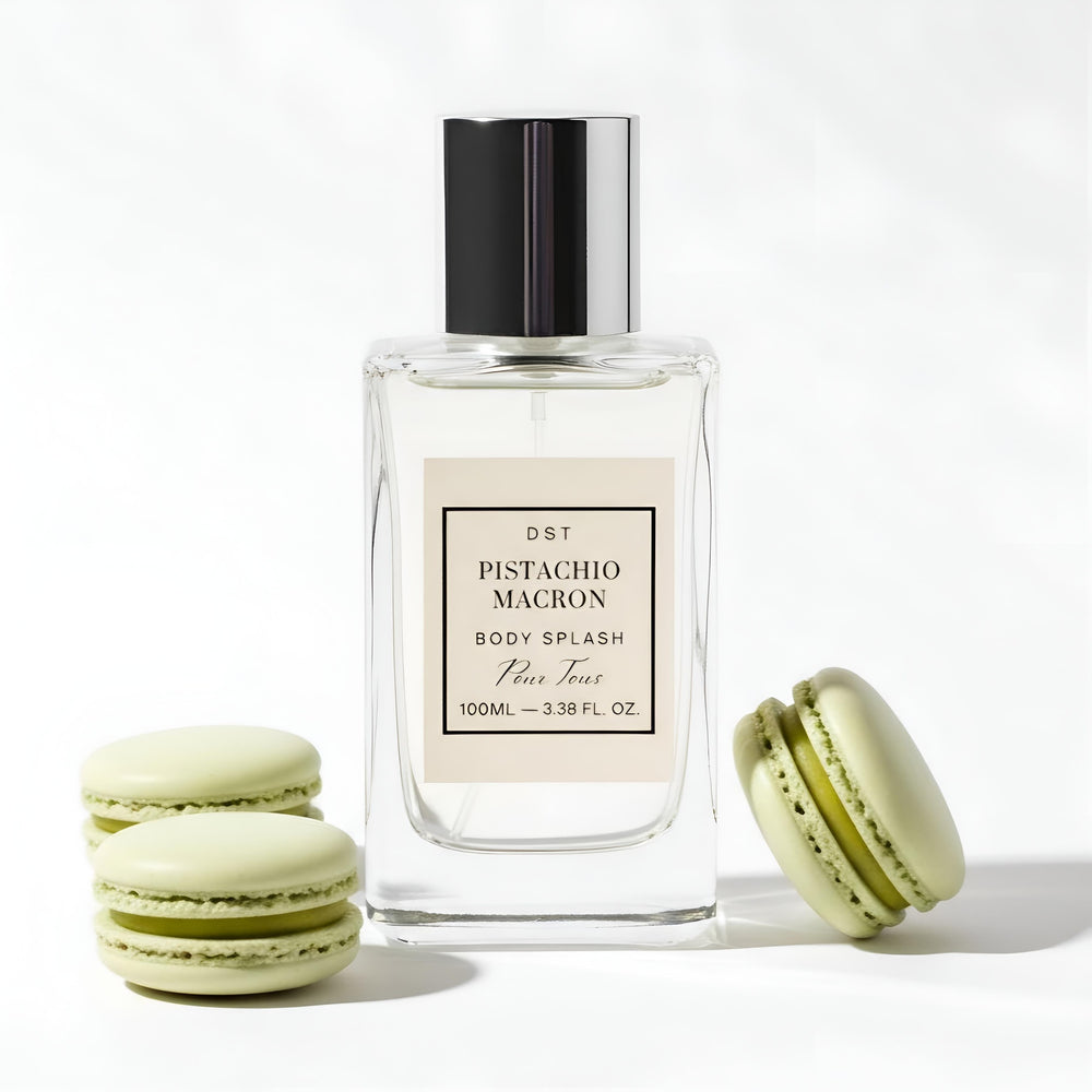 Pistachio Macron body splash bottle with macarons on a white background