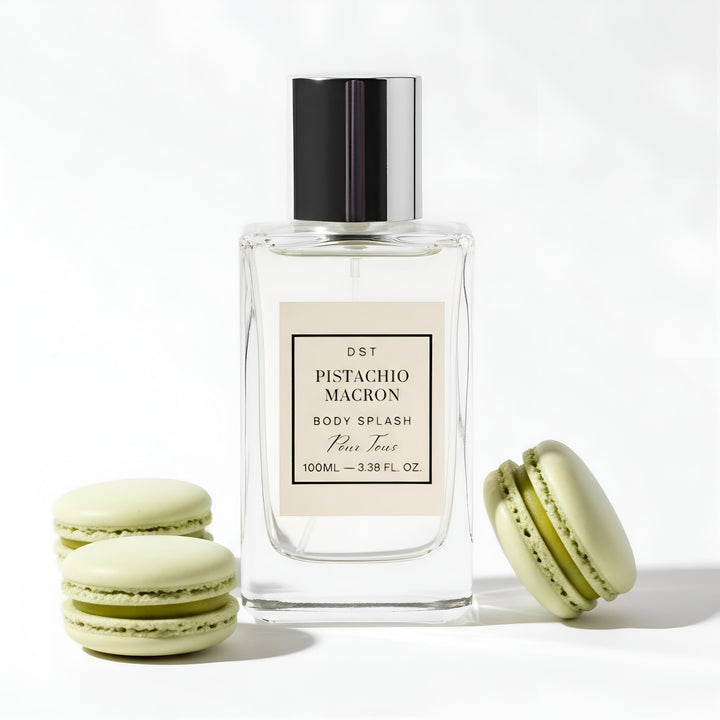 Pistachio Macron body splash bottle with macarons on a white background