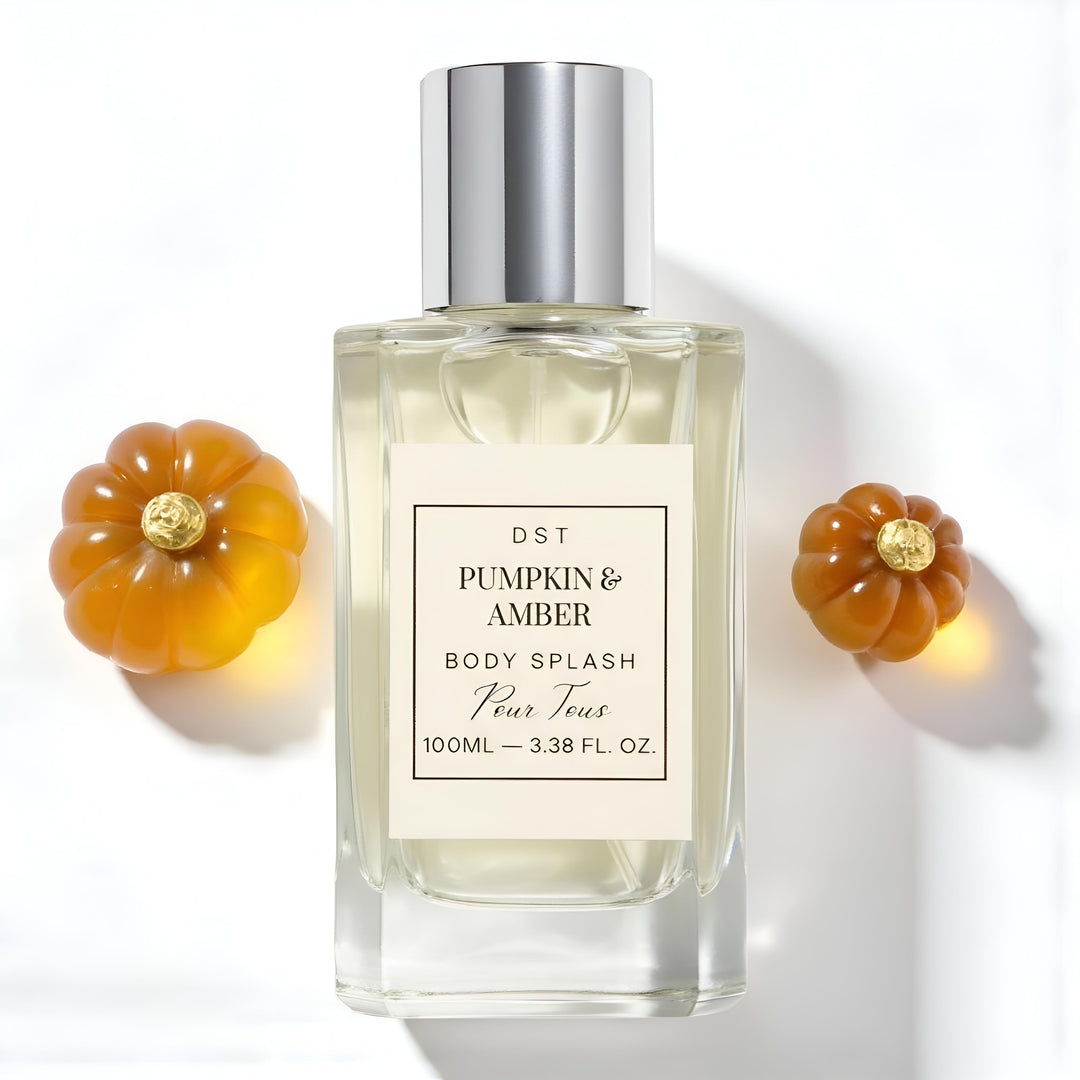 Perfume bottle labeled 'Pumpkin & Amber' with decorative pumpkins on a white background
