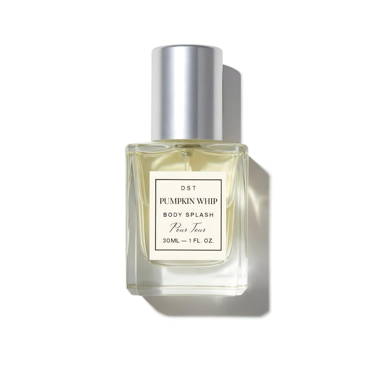 Bottle of 'Pumpkin Whip' body splash with a white cap on a white background