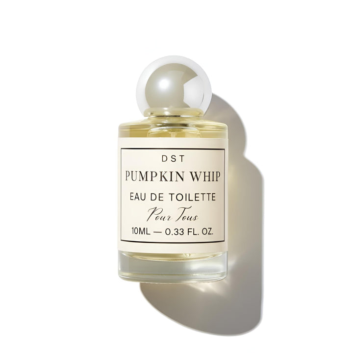 Perfume bottle labeled 'Pumpkin Whip' by DST on a white background
