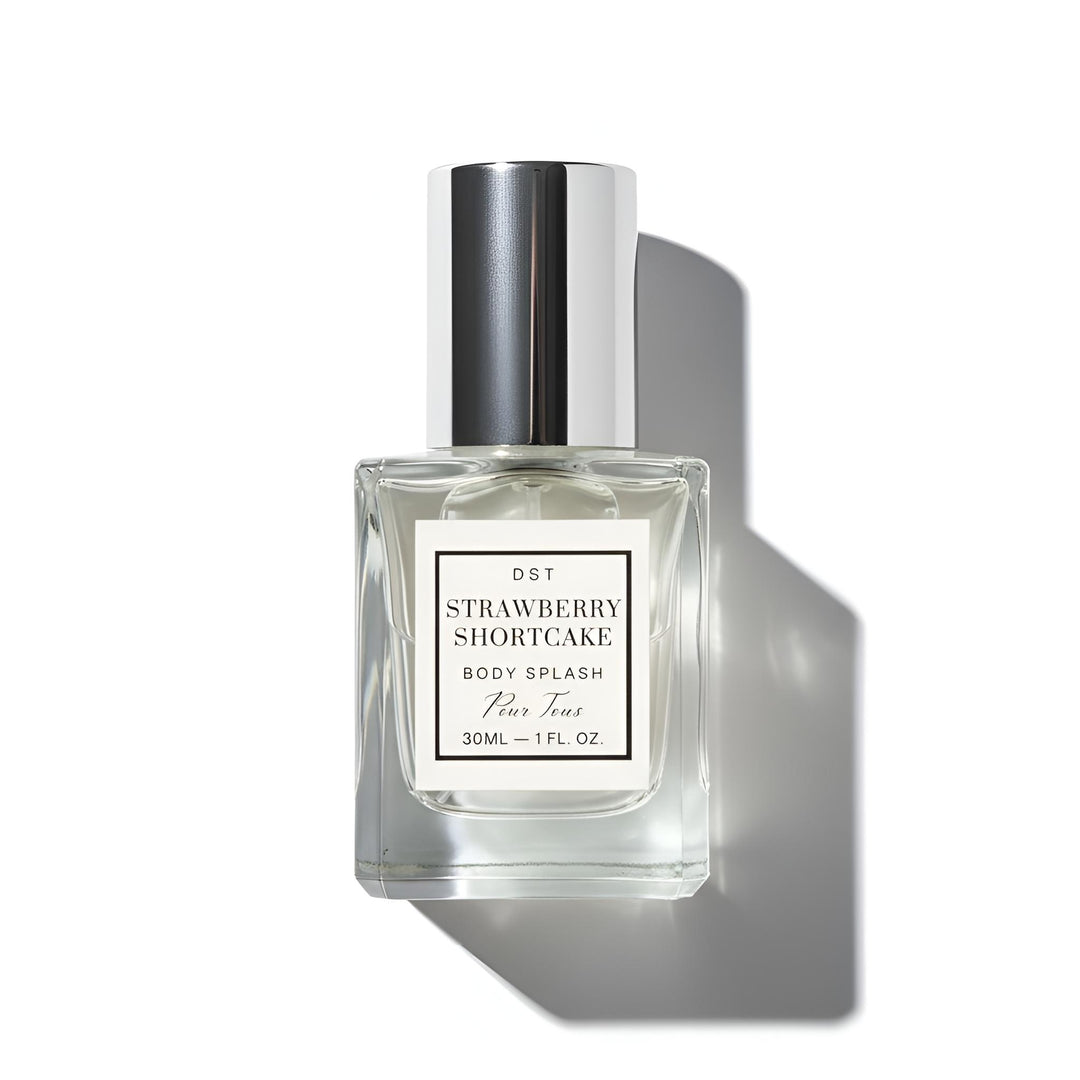 Clear bottle of Strawberry Shortcake body splash with a white label on a white background