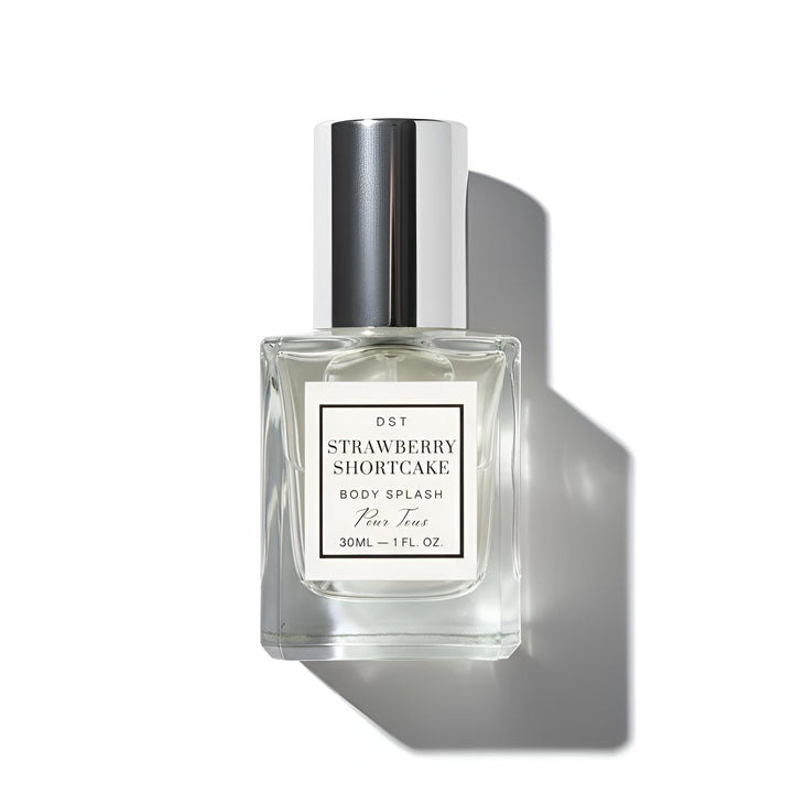 Clear bottle of Strawberry Shortcake body splash with a white label on a white background