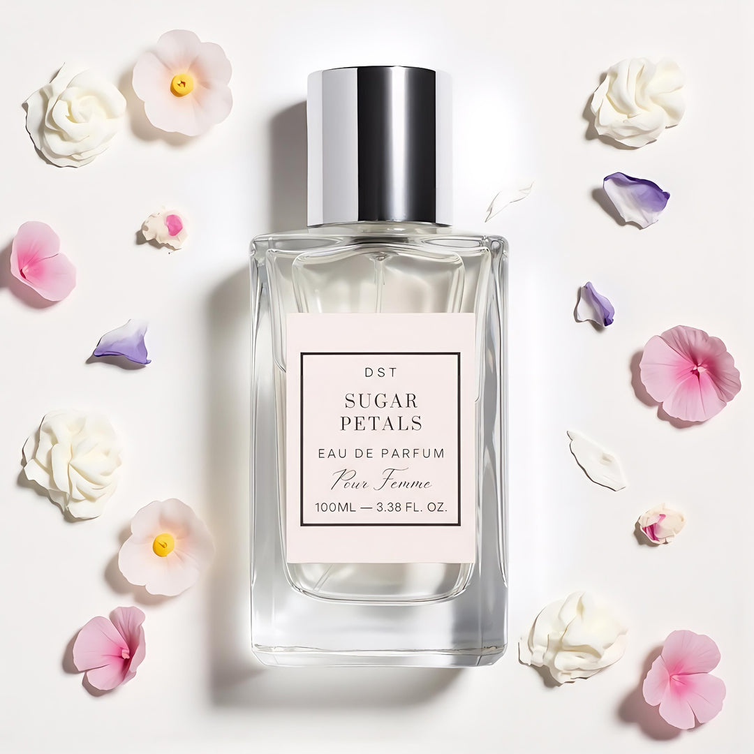 Perfume bottle labeled 'Sugar Petals' with flowers around on a light background