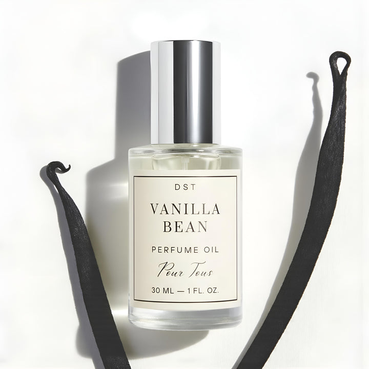 Vanilla Bean Perfume Oil against ivory backdrop with vanilla
