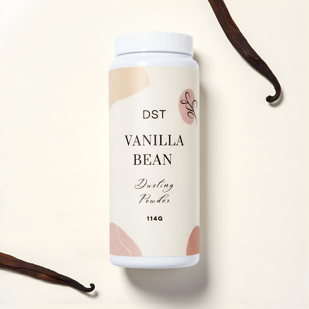 Vanilla bean dusting powder container with vanilla beans on a beige background