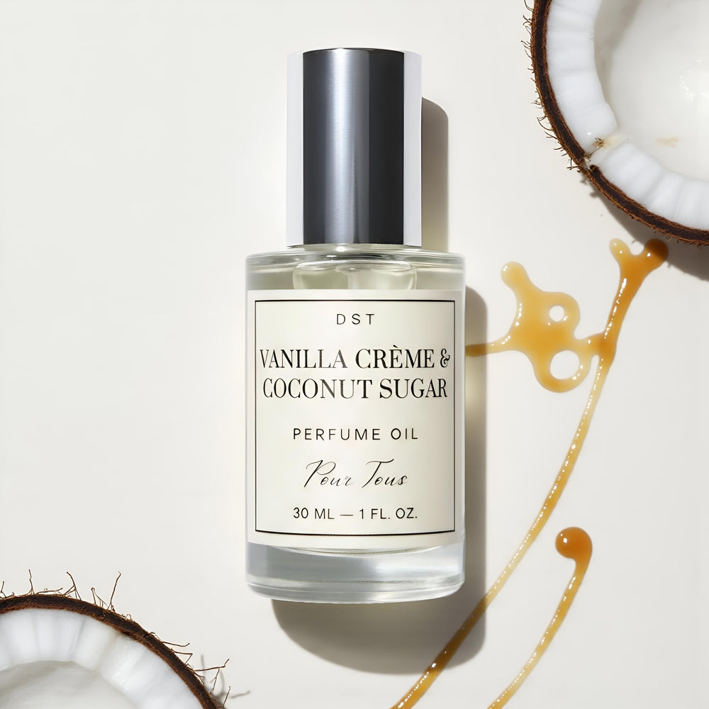 DST Fragrances Perfume oil bottle labeled 'Vanilla Crème & Coconut Sugar' surrounded by coconut pieces and caramel drizzle on a light background