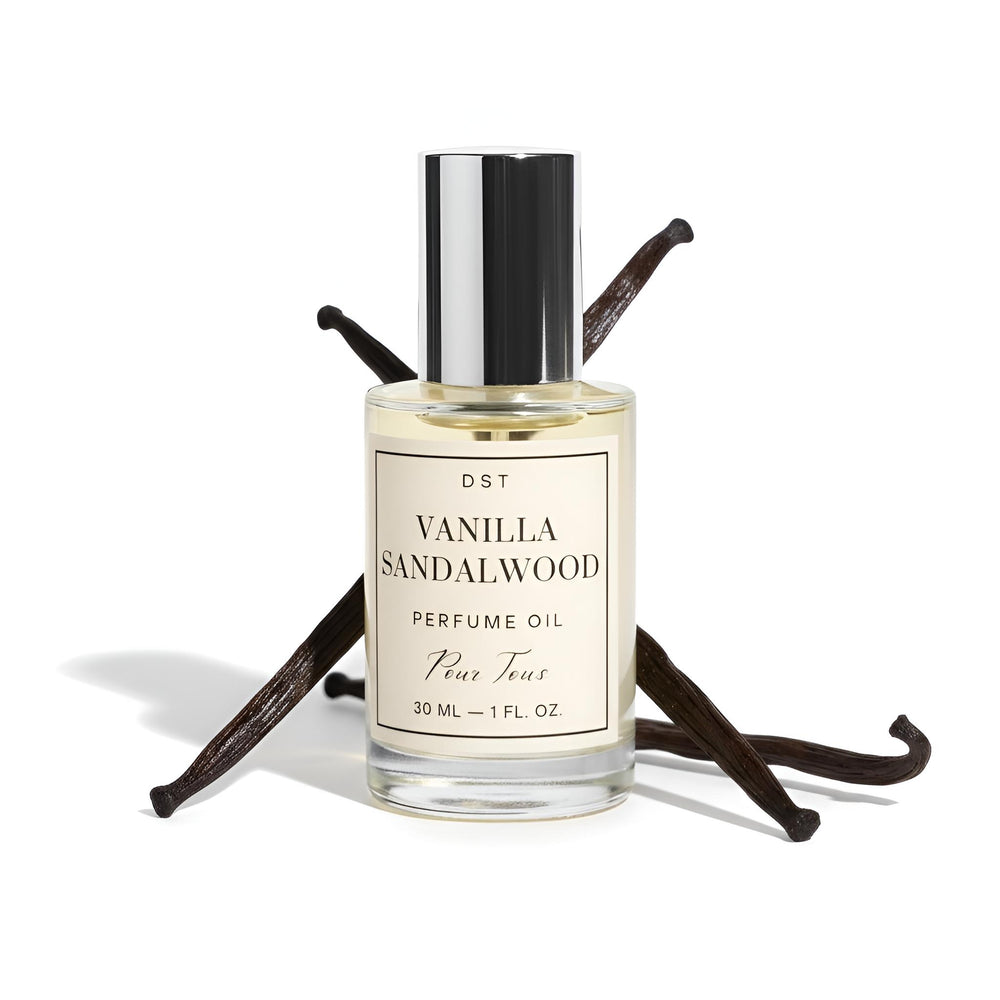 DST Fragrances Vanilla sandalwood perfume oil bottle with vanilla beans on a beige cloth background