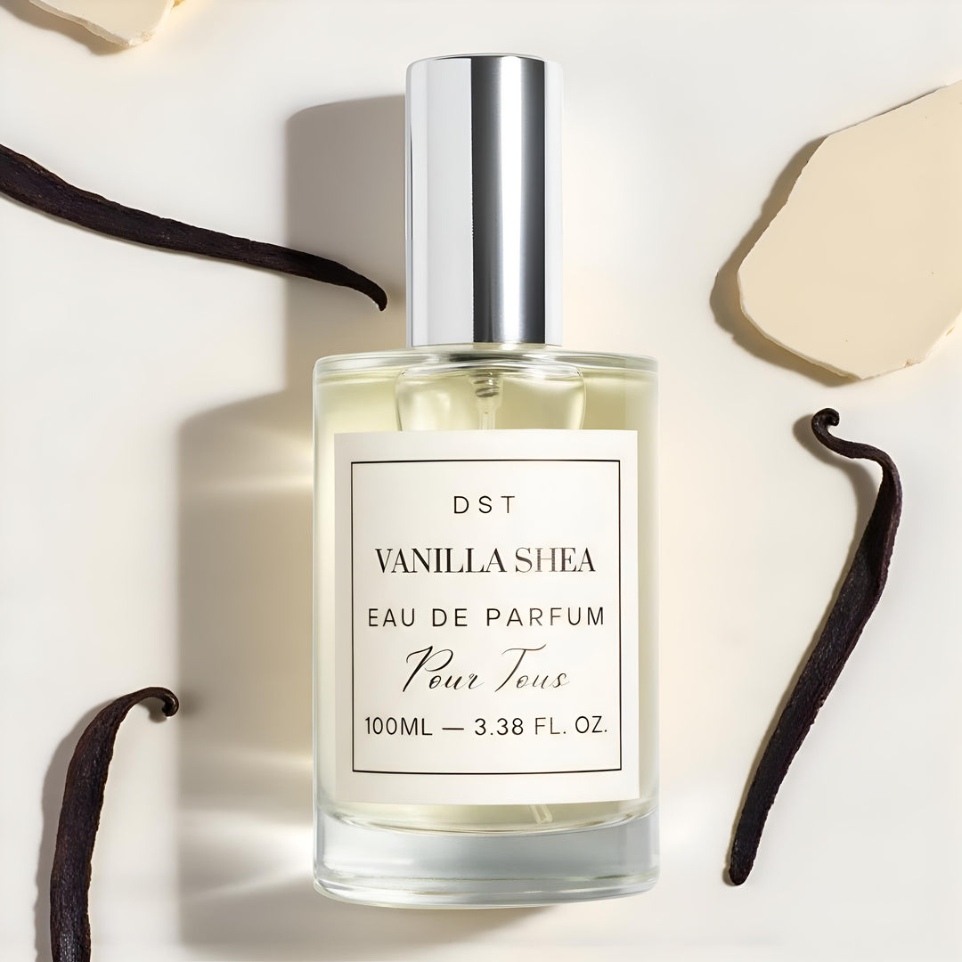 Vanilla Shea Eau de Parfum bottle with vanilla beans on a light background