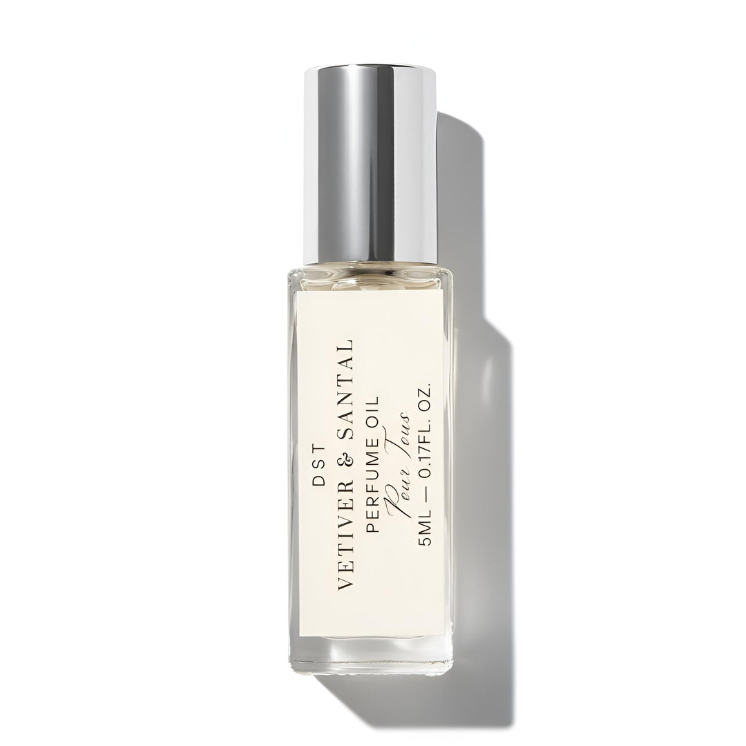 vetiver Santal Perfume oil bottle with silver cap on a white background