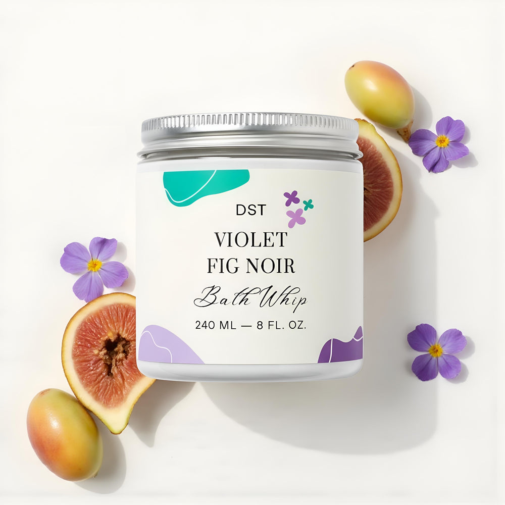 Bath whip container labeled 'Violet Fig Noir' with fig halves and a purple flower against a white background.