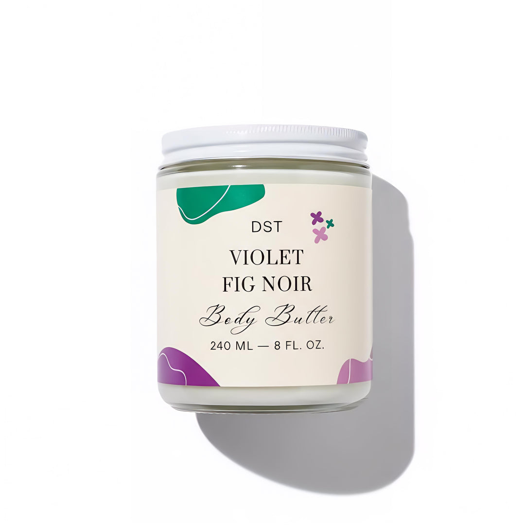 DST Fragrances Body butter jar labeled 'Violet Fig Noir' with decorative elements on a white background