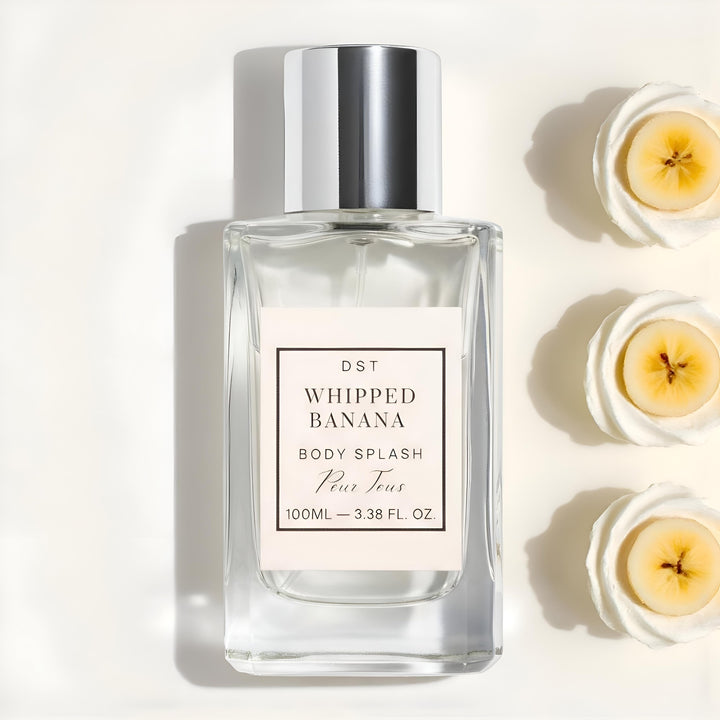 Body splash bottle labeled 'Whipped Banana' with banana slices on a light background