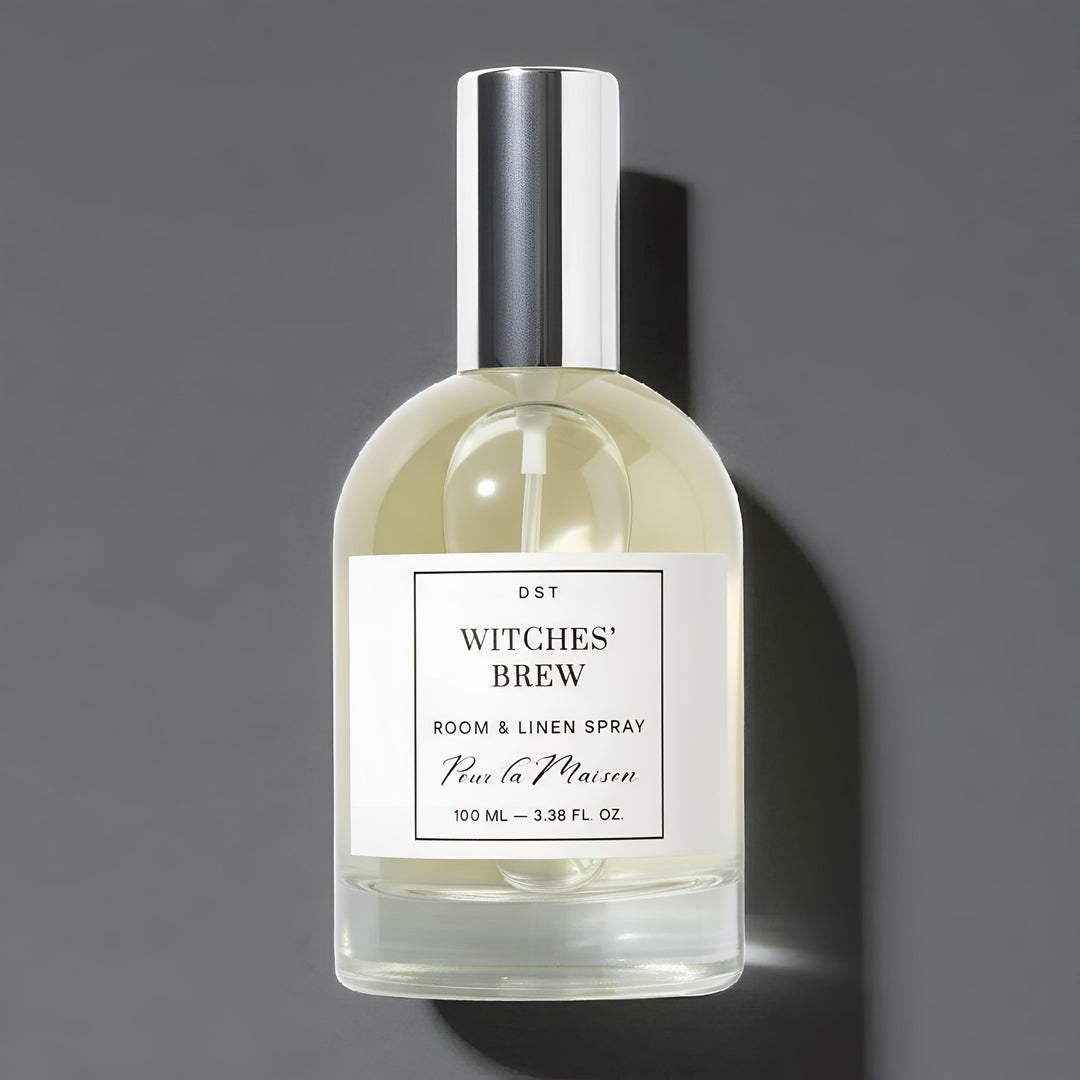 Bottle of 'Witches' Brew' room & linen spray with a gray background