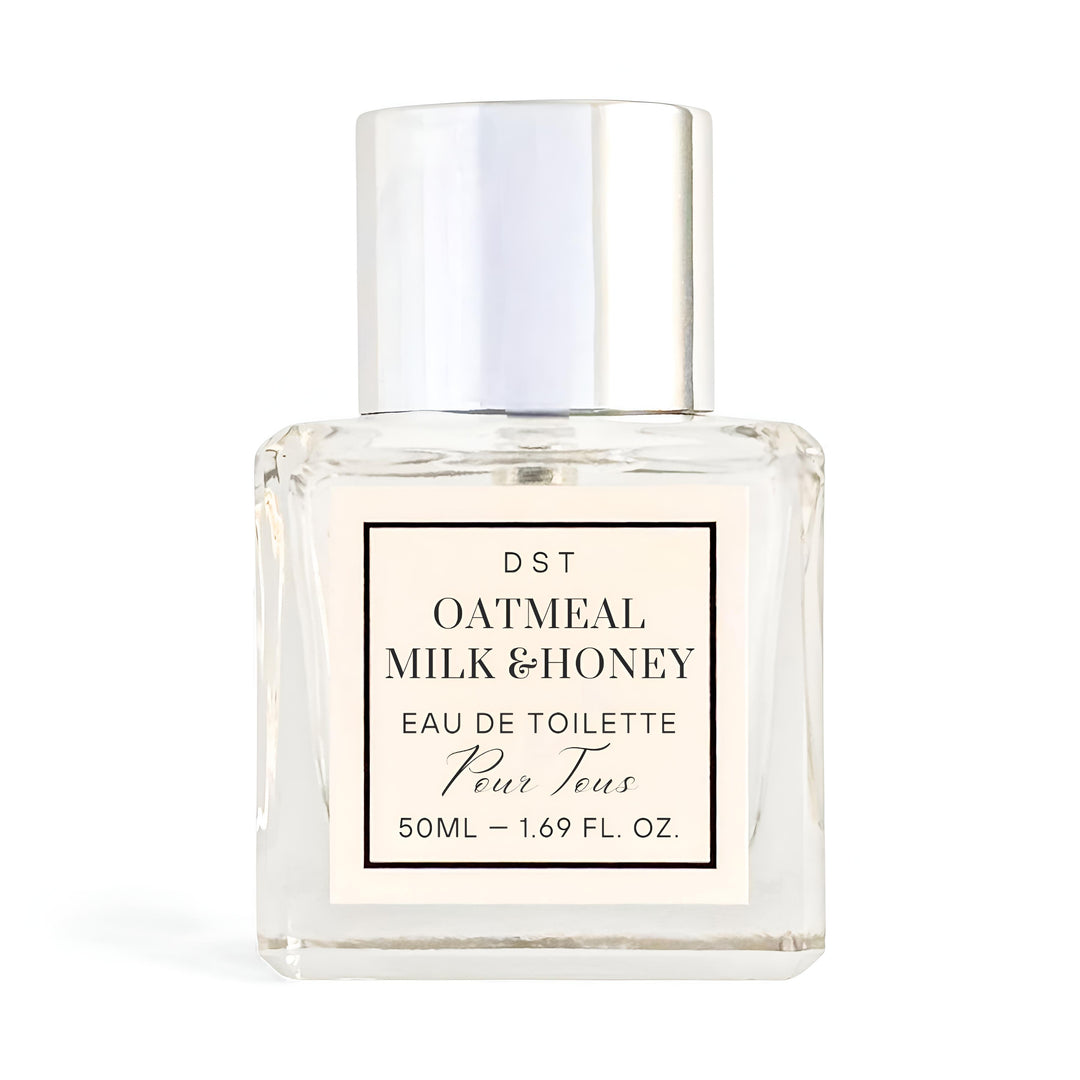 Bottle of DST Fragrances Oatmeal Milk and Honey Eau de Toilette on a white background with contact shadow.
