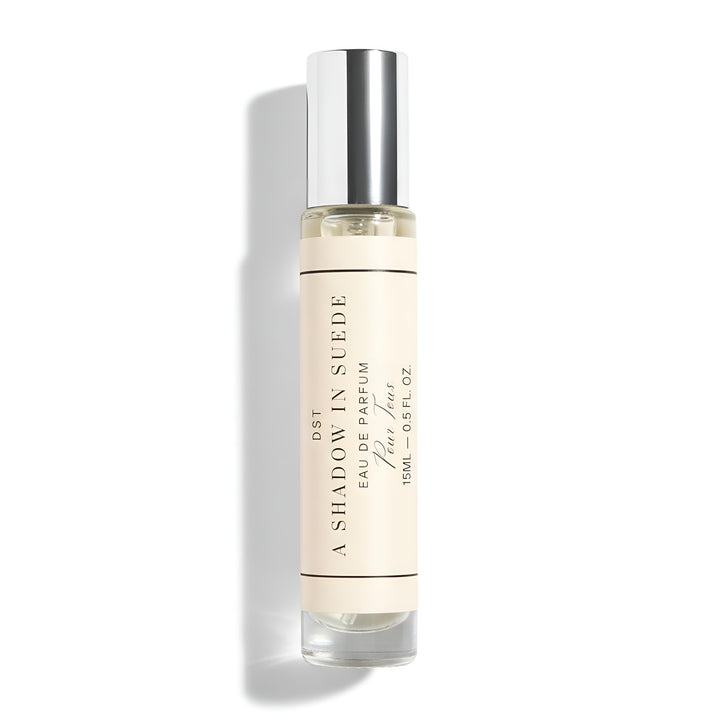 A 15ml bottle of DST's "A Shadow in Suede" Eau de Parfum against a white background.