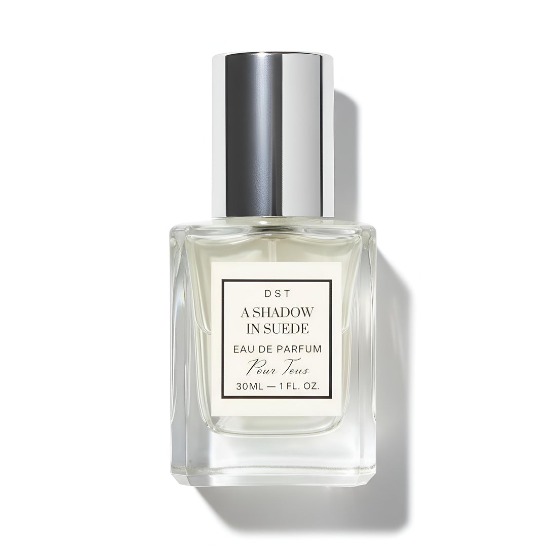 A 30ml bottle of DST's "A Shadow in Suede" Eau de Parfum against a white background.