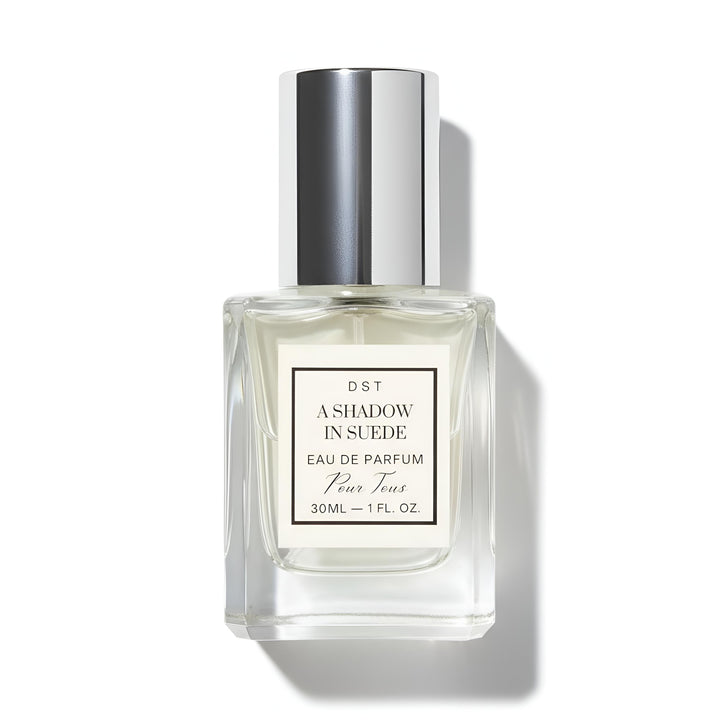 A 30ml bottle of DST's "A Shadow in Suede" Eau de Parfum against a white background.