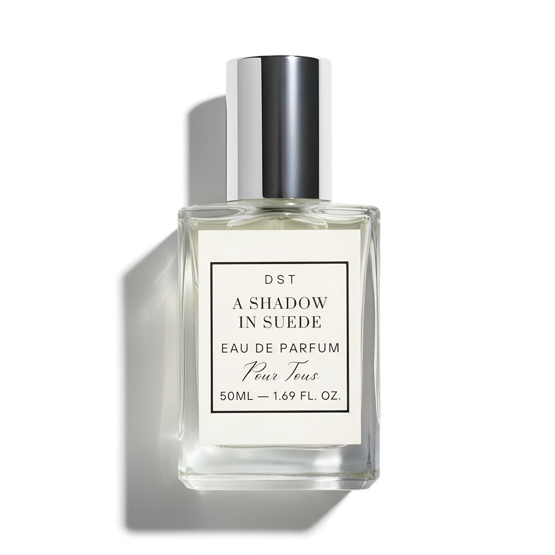 A 50ml bottle of DST's "A Shadow in Suede" Eau de Parfum against a white background.