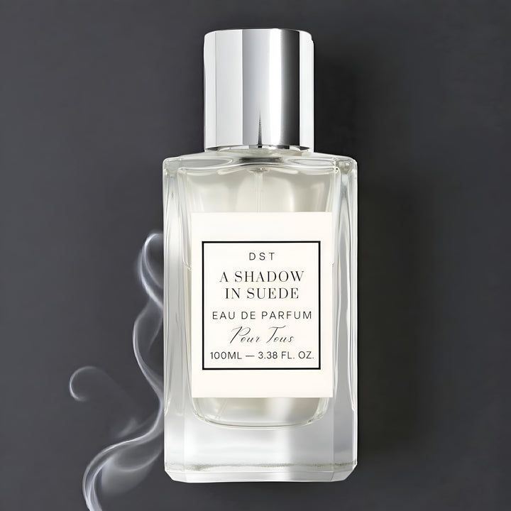 A Shadow in Suede Eau de Parfum against a smokey grey background.