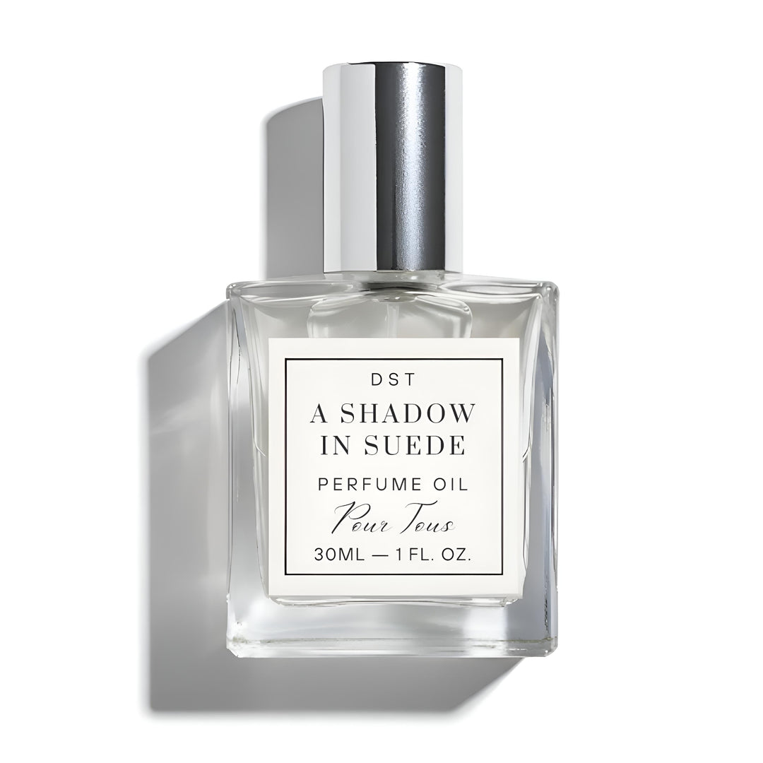 Perfume oil bottle labeled 'A Shadow in Suede' on a white background